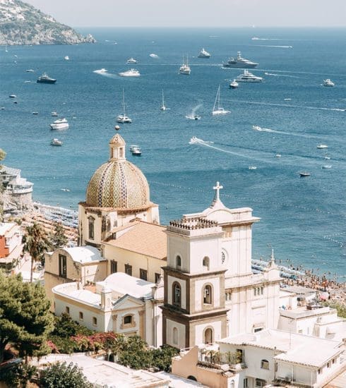 Amalfi coast image with a church and yachts in the view