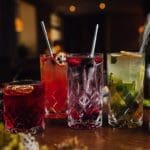 Four glasses of drinks in a bar