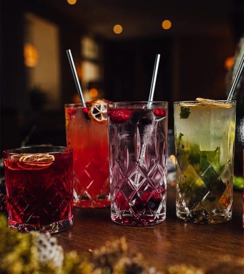 Four glasses of drinks in a bar