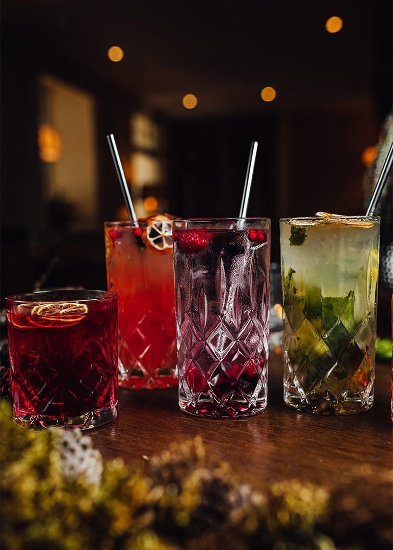 Four glasses of drinks in a bar