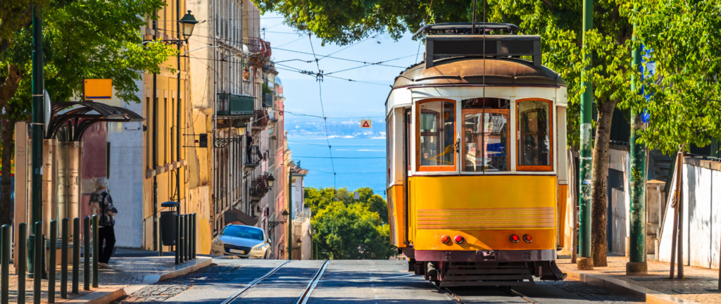 Yellow vintage tram on the street in Lisbon - Portugal